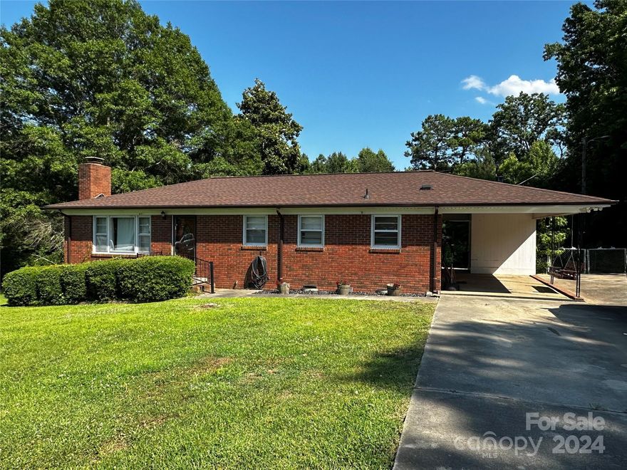 Nice all brick ranch home on large lot in great neighborhood! Whether it's your first home or your last home, this one has great potential. The home has hardwood floors in the hall and bedrooms and LVP in the kitchen and dining room. The kitchen has a built in wall oven, counter top cooktop and breakfast island. The full bath has been updated and kitchen cabinets have been refaced also. You will like the attached carport, paved drive and large fenced back yard. This area is located minutes to I77 where you can be in Rock Hill, Charlotte or Columbia in approximately 40 minutes. Investors, this home has great potential for a rental property or a flip. Priced aggressively and sold strictly as-is. Great Falls is home to the new white water center, Carolina Adventure World, the Carolina Thread hiking trail and minutes to Lake Wateree.