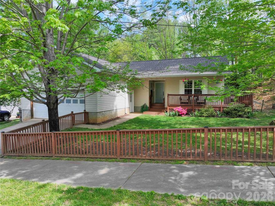 Updated West Side bungalow on fully fenced corner lot tucked away on a quiet cul-de-sac. The covered wraparound porch welcomes you inside, just steps from a two-car garage ideal for storage, a workshop, or additional flex space. The bright living room with fireplace flows into renovated kitchen and dining area, while the side porch offers a perfect spot for morning coffee or shaded afternoon relaxation. The dedicated laundry room sits conveniently off the kitchen and the hall leads to three bedrooms and two full baths. The flexible floor plan also offers potential for a primary bedroom Homestay with private entrance and patio, and past income of $20,000 a year.  In addition to all the cosmetic upgrades, the home also has a new roof (2025) and new HVAC (2025). With all the must-haves and plenty of perks, this home is just minutes from the shops, dining, and energy of Haywood Road, and easy access to the interstate.