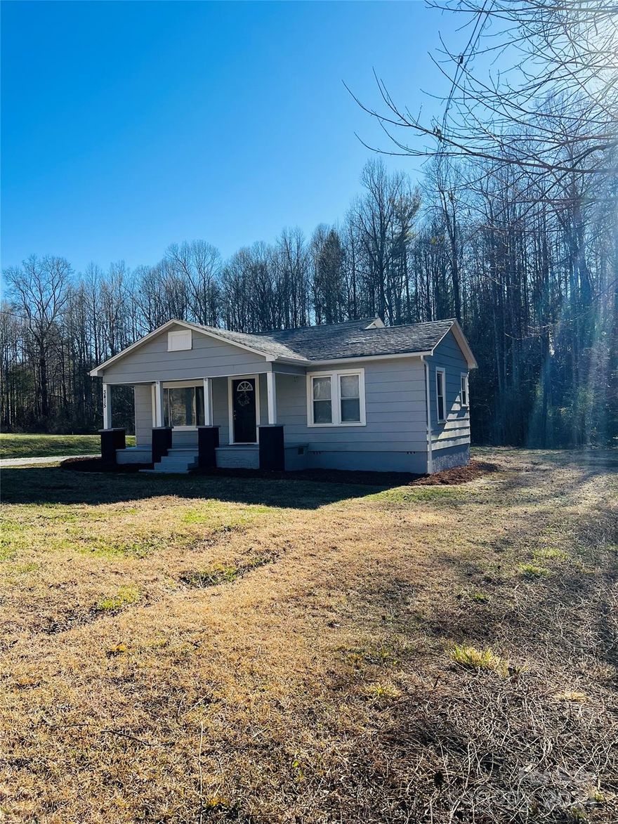 Enjoy the solitude of sitting on a covered porch listening to the sounds of nature in recently renovated 2 bed/1 bath bungalow on 2.64 acres. Paved drive with newly placed gravel to side/rear for ample parking or choose to park in the large garage in back. A small creek runs the back edge of property and sellers have cleaned up the rear lot to provide lots of room for outdoor activities. Fall in love with the coziness of this home and its well apportioned rooms. Fresh paint, new blinds, vinyl plank flooring, light fixtures, along with new countertops, knobs & appliances in kitchen (except for the fridge). Outside, gutters and steps were tightened/replaced as needed and fresh mulch applied for you to plant spring flowers.
