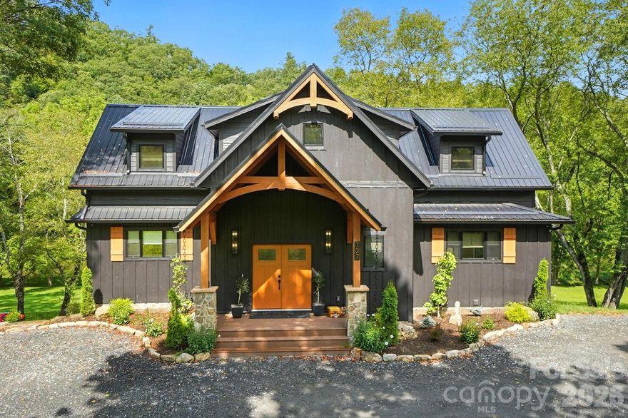 Step inside to discover the modern finishes and thoughtful details that adorn this home, from the open concept layout to the abundance of natural light that shines through the expansive windows overlooking the New River! The heart of the home is the contemporary kitchen, complete with sleek appliances, Quartz countertops, custom cabinetry, a coffee bar, accent wall, and ample storage space for all your culinary needs. The primary bedroom is on the main level with wood accent beams, walk-in closet, and views of the river. Primary bathroom continues the modern theme of the home with a floor-to-ceiling tiled shower, dual vanities, and elegant fixtures. On the third level of the home, you will find two large bedrooms with en-suite bathrooms and a loft area that can be used for a home office. Entertain in the spacious living area or take the festivities outdoors to the 1.5-acre lot and large wraparound deck. Unwind in the evenings in your very own hot tub, creating an oasis of relaxation and breathtaking views of the river and the surrounding mountainside. You may even see a family of deer. For those seeking additional space, the large basement offers more entertainment options with a recreation area and well-equipped bar with a ‘speak easy’ vibe. The bunk room with a full bathroom completes the basement area. Don't miss your chance to make this modern farmhouse property your own personal sanctuary, where peaceful riverside living meets contemporary luxury. Schedule your showing today and start living the lifestyle you've always dreamed of. Property is being sold fully furnished aside from a few items.