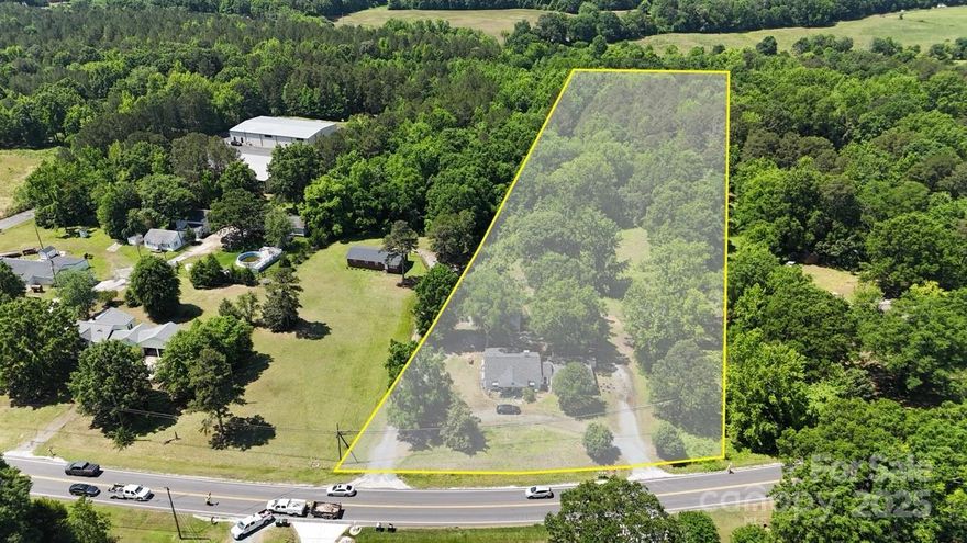 This ±6-acre property includes two parcels and two existing structures (single family home and duplex) that are currently occupied and offer immediate income until the site is developed or to hold long term. This site is positioned well on Old Charlotte Hwy with proximity to Monroe, Indian Trail, US-74 and lots of new residential development in the area. Zoned RMD through the City of Monroe, the site allows for both singlefamily detached and townhome-style attached housing, with by-right zoning supporting 3 units per acre. Water and sewer are accessible.