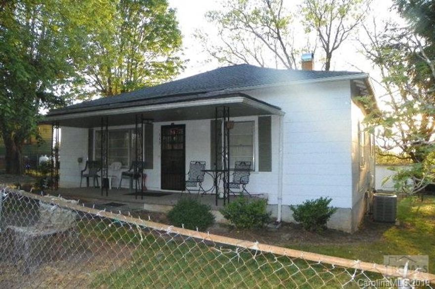 Affordable housing! Why pay rent when you can buy for less than rent payment? Well maintained bungalow with central heat/air features two large bedrooms, living room, dining room, eat-in kitchen. Single carport. Relax on front porch and enjoy the spring weather! Storage building. Large garden area.  Seller providing one-year home warranty.