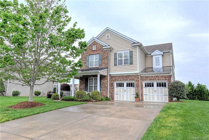 Elegant formals, hardwood floors, 2-story great room w/frpl, study w/ French doors & wonderful open kitchen -this one has it all! Huge master w/ sitting area, garden tub, shower & 2 walk-in closets. Ceiling fans in all BRs. Wrap around porch & brick accent give great curb appeal. Relaxing patio overlooks the lush backyard with exterior storage building. Community pool, playground & green space minutes to shopping, dining in Wesley Chapel!