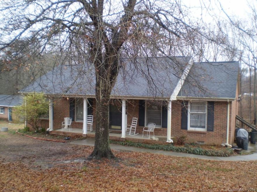 Brick home on large lot with pool and wired workshop.