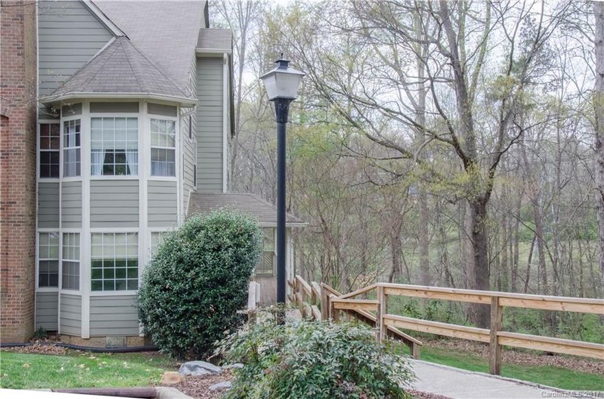 Private wooded ground floor unit  in Bennington Woods! Great condo featuring an open living area and split bedroom plan. Both bedrooms offer walk in closets and  baths. Sunroom with custom window treatments is the perfect place to look out into nature. Private back deck has peaceful views of the woods. SO MUCH storage including a large walk in pantry and a separate utility closet. Direct access to the Greenway.