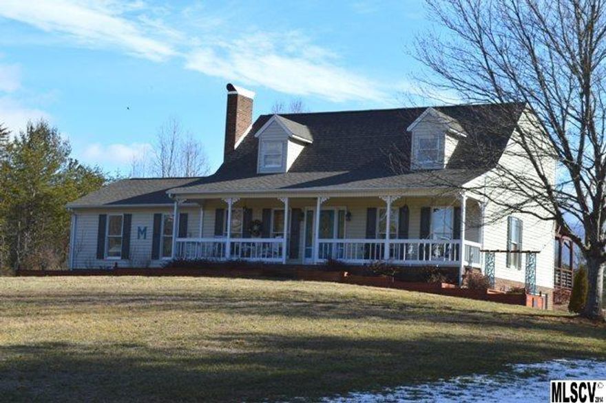 The Great Escape!! This gorgeous home in the country is in "mint" condition!! Sitting on almost 3 acres there is plenty of room for a couple of horses, chickens, dogs and a huge garden.  Located in historic Yadkin Valley this dream house is only 15 minutes to Lenoir and 25 minutes to Blowing Rock.  Sit on the front porch and enjoy the great view of the mountains!  Sitting at the end of a great neighborhood with wonderful neighbors enjoy your privacy while living in this "country paradise".  Owners have totally updated this 3 BR 2 Bath home.  Gorgeous outdoor living spaces, modernized kitchen, refinished hardwood flooring, newer roof, heat pumps(2), tiled fireplace, re-painted, tile work, you name it, they've done it!!  Rooms are very spacious with the kitchen and Great room open, Large MBR, bath, huge closet in MBR.  Upstairs BR are very large as well.  Great shop area in the basement with plumbing available for bathroom. This is truly a wonderful house in a great area!!