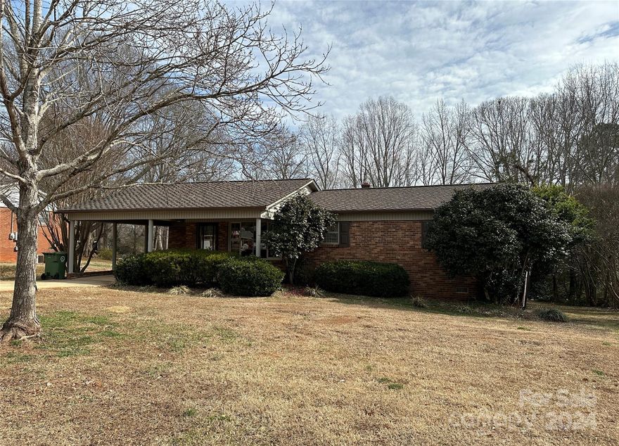 Great Ranch, one owner, Property is in Excellent condition, Only needs some updating.  HARDWOOD IS UNDER ALL CARPET. Home was a 3 bedroom and seller took out wall between 2 bedrooms and made a larger room, could easily be put back for 3 bedrooms, Nice having a carport,  Back yard is very large with storage buildings.  Great for 1st time home buyers or a rental.