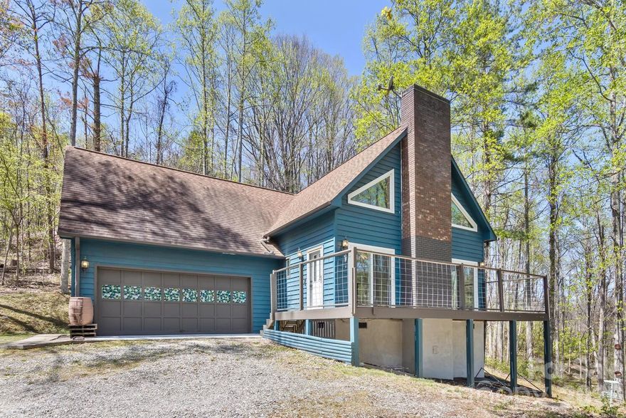 Tucked into the woods on a private 1.8-acre lot in the Ox Creek area, this modern mountain cottage offers privacy, natural beauty, and thoughtful updates just minutes from the Blue Ridge Parkway and nearby hiking trails. Surrounded by mature trees and the sounds of nature, enjoy peaceful mornings with birdsong and serene woodland views right from your own property.

Featuring 2 bedrooms, 2 baths, and ~1,300 sq ft, the home showcases vaulted ceilings, abundant natural light, and striking architectural lines. The remodeled kitchen includes newer appliances, butcher block countertops, and fresh finishes. Vinyl plank flooring runs throughout the main living areas and bedrooms, with tile in the bathrooms. New hot water heater!

Painted cedar siding adds durability, while a large deck provides the perfect space to relax, entertain, and take in the surrounding forest. A garage adds convenience and additional storage.