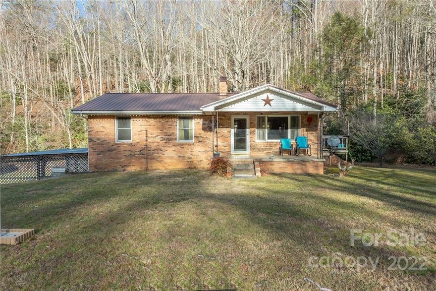 Looking for a secluded home that generates its own electricity? This house comes equipped with solar panels that power the home and sells the excess back to the electric company. Solar panels are still in the warranty period and transfers with ownership. Fiber optic internet is ran to the property, and available. Home is located near the Appalachian trail. Basement is partially finished. The workshop is an old store, and has a separate full bathroom with a shower. Enjoy the wonderfully secluded yard and creek that runs along the property. Lots of space for gatherings and outdoor entertaining. Look no more. You've found excellent rural living. Ideally positioned in quiet Madison County.