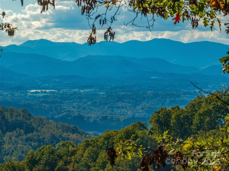 Don’t miss this rare opportunity to own one of Asheville’s most breathtaking view lots. This stunning 2.75-acre homesite at 273 Serenity Ridge Trail, Lot 36, sits atop the highest ridge in the exclusive Serenity community and offers truly panoramic, layered mountain views that are among the best remaining in the area.

With an exceptionally level building site and extremely gentle topography, this lot is ideal for one-level living or virtually any architectural design. Its southwest orientation captures golden afternoon light, and its end-of-the-road location ensures privacy, quiet, and minimal site prep costs.

Although it feels like a private mountain retreat, the homesite is just 3 minutes from Ingles and only 10 minutes to downtown Asheville, offering the perfect balance of seclusion and convenience. Survey and custom home plans are available upon request—start building your mountain dream home today.