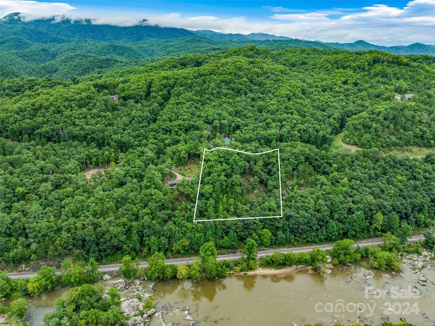 Ever dream of building a home overlooking a rushing river with a mountain view? You can have that
and more at French Broad Crossing, a gated community approximately 30 minutes from Asheville.
Amenities include The River Lodge where you have a Fitness Center, Pool, & Hot Tub. Down the road
is a River Park directly on the mighty French Broad River where you will also find a Tree House
Park. There are also miles of Hiking and ATV Trails. You can build your dream home on this lot and
have a back deck overlooking the river and mountains - what more could you ask for? Come see for
yourself.