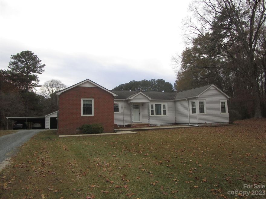 Prime property located just outside the town limits of Wingate on Hwy. 74. (west of town/Monroe side) 34.26 acres with over 1000 feet of road frontage on Highway 74. Also includes neat, classic, traditional ranch with 3 bedrooms/2 bathrooms and 1631 square feet heated area. Primary value is in the land but home also could have many possible uses. Property has public water and well, but owners have always just used well. Sewer lines run on back of property, but Seller uses septic tank. Beautiful acreage is open & wooded. Property has been in Seller's family for years and actually includes 1.14 acres (.79 approx. net outside of right-of-way) on north side of Highway 74 * Small area on back side of property is in a floodplain.*
Price is based on certified appraisal that was just completed. Unique opportunity here on very special property!