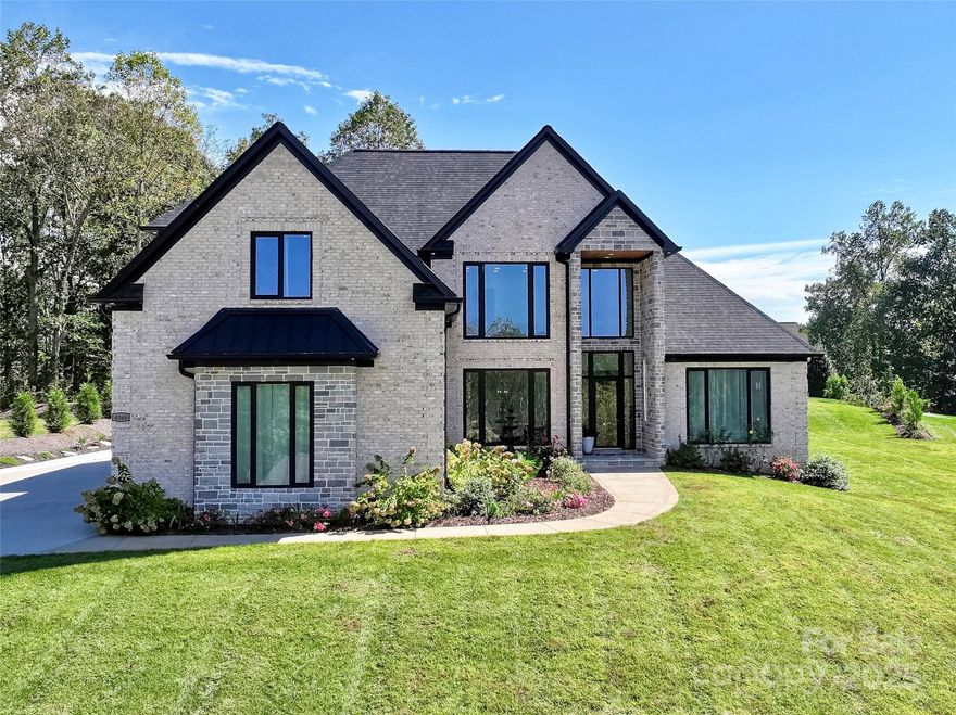 Come and see this one-of-a kind custom home built in 2022 at Rock Barn Country Club & Spa.

This stunning home offers 4,857 sq. ft. +/- of custom luxury living in the highly sought-after Rock Barn Country Club & Spa. With 5 bedrooms, 4.5 bathrooms, and a rare double master suite layout, this home blends modern elegance with thoughtful design. You will fall in love with so many offerings: coffered ceiling great room, breath-taking kitchen design, a hidden cabinet pantry, two linear electric fireplaces, exquisite tile works around recessed TV mounts, heated bathroom floors, a primary bath wet room, soaring 10-foot ceilings, oversized doors, rich details, and expansive living spaces perfect for entertaining or relaxing. 

You won't have to worry about the details either, with Cat6 wiring and a camera system that is tucked away seamlessly! Just steps from the private Jones course 7th hole tee box, you'll enjoy all that Rock Barn has to offer—including two championship golf courses, a world-class spa, equestrian facilities, fine dining, tennis, pickle ball, fitness, and the large pool complex. Whether you’re a golf enthusiast, spa lover, or simply looking for a vibrant community with endless amenities, this home places you in the heart of it all.

This is more than a home—it’s a lifestyle. Don’t miss your chance to own one of Rock Barn’s true showcase properties.