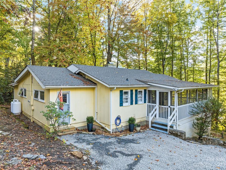 What a cute and well-maintained home with a gorgeous fireplace to cozy up next to! Anyone who loves to cook will appreciate the expansive kitchen this home offers with granite countertops, stainless steel appliances, and plenty of space to entertain! Conveniently located in Maggie Valley just a couple of minutes to the shops and attractions in the valley. Enjoy the screened-in porch surrounded by the lush trees in summer providing plenty of cooler temperatures on the warmer summer days. Split bedroom floor plan with a spacious living room and kitchen. This home would make a great vacation rental or second home! Roof installed in Sept/Oct 2023, several upgrades to plumbing, and more (see attached list of repairs/upgrades). Sewer agreement in place with neighbors. Buyers will need to sign for recording. Recently appraised!