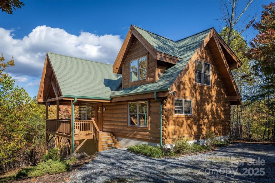 Rustic Log Home on 2.4 acres offering long-range mountain views and all the natural serenity that the Blue Ridge Mountains are famous for. Offered Partially Furnished! Located in the popular gated community of Grandview Peaks, this home offers 3 levels of living space with 2 bedrooms and 3 full baths including one in the finished basement - the perfect setting for a second family room, home gym, or man cave/game room. The land has a gentle slope, providing ample space for outdoor living, gardening, or simply relaxing in nature.  The covered gable front porch and open decks on two sides offer lots of space for grilling, lounging, or entertaining friends. Inside, the family room has high ceilings, centered around a gas log fireplace. There's both a dining area and a breakfast bar off the kitchen island to accommodate many visitors. The kitchen is open with wood cabinets & stainless steel appliances. Bathrooms are spacious with tile showers & lots of storage. The primary bedroom is upstairs with an en-suite bathroom, walk-in closet, and a loft overlooking the family room - the perfect spot for a home office or hobby space. The finished basement offers a huge open den, the perfect spot for a movie night or to watch the big game. It would also make a fantastic game room or extra sleeping space for guests. The laundry room is located in a large utility room with lots of storage space. This home has been partially used as a short-term rental with a great rental history. The community offers miles of hiking trails and a small stocked lake for swimming, fishing, or kayaking. Next to the lake is a white sand beach, a floating dock, 2 stationary docks and a large heavy timber pavilion for picnicking and neighborhood gatherings. Come see all this wonderful mountain home and community has to offer!