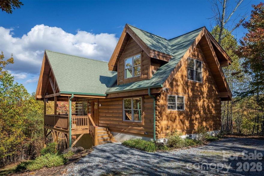 Rustic Log Home on 2.4 acres offering long-range mountain views and all the natural serenity that the Blue Ridge Mountains are famous for. Offered Partially Furnished! Located in the popular gated community of Grandview Peaks, this home offers 3 levels of living space with 2 bedrooms and 3 full baths including one in the finished basement - the perfect setting for a second family room, home gym, or man cave/game room. The land has a gentle slope, providing ample space for outdoor living, gardening, or simply relaxing in nature.  The covered gable front porch and open decks on two sides offer lots of space for grilling, lounging, or entertaining friends. Inside, the family room has high ceilings, centered around a gas log fireplace. There's both a dining area and a breakfast bar off the kitchen island to accommodate many visitors. The kitchen is open with wood cabinets & stainless steel appliances. Bathrooms are spacious with tile showers & lots of storage. The primary bedroom is upstairs with an en-suite bathroom, walk-in closet, and a loft overlooking the family room - the perfect spot for a home office or hobby space. The finished basement offers a huge open den, the perfect spot for a movie night or to watch the big game. It would also make a fantastic game room or extra sleeping space for guests. The laundry room is located in a large utility room with lots of storage space. This home has been partially used as a short-term rental with a great rental history. The community offers miles of hiking trails and a small stocked lake for swimming, fishing, or kayaking. Next to the lake is a white sand beach, a floating dock, 2 stationary docks and a large heavy timber pavilion for picnicking and neighborhood gatherings. Come see all this wonderful mountain home and community has to offer!