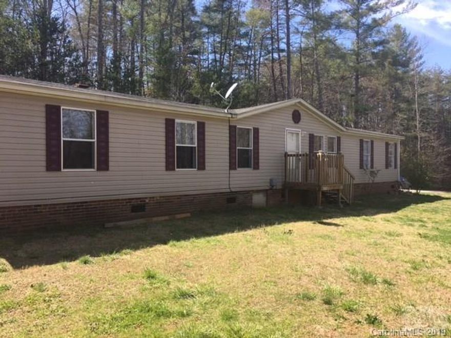 4 Bedroom/2 Bath mobile home with split bedroom design.  Home has formal living/entry room, formal dining room and large family room with wood burning fire place.  Large back deck connects to a ground level entertainment patio.  This home is situated back from the main road to ensure owner privacy. Close to Hwy 181, downtown Morganton, and Lake James!!