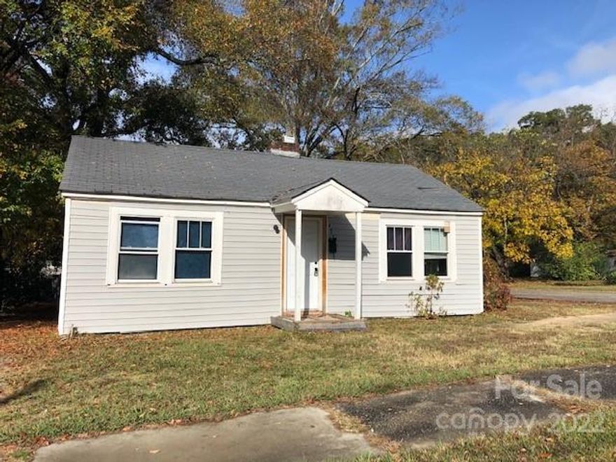 Cute cottage that has been stripped down to the studs. Located in great area on a corner lot, very close to downtown Rock Hill, near new restaurants and fountain, as well as highway access (I-77).  Covered front porch.  Fireplace was wood burning at one time but not functioning to agent's knowledge.  Water heater is also not functioning to agent's knowledge. Tons of potential! Parking in the driveway.
