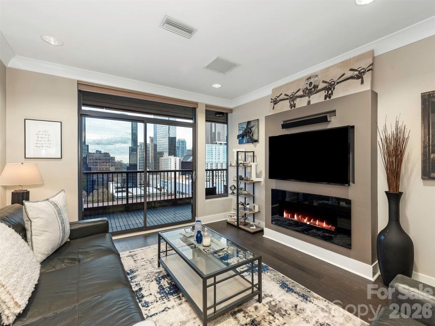 Meticulously kept, turnkey, 1BR/1BA condo located in the heart of Uptown Charlotte. Unit 1706 features an open floor plan with large windows that flood the space with natural light and showcase breathtaking skyline views. Step onto your private balcony and enjoy incredible west-facing sunsets that paint the city in unforgettable colors each evening.

Updated in April of 2024, the kitchen offers modern finishes, sleek cabinetry, and ample storage. This home features custom wide plank hard wood flooring, automatic blinds in the living room, custom lighting, and custom-built fireplace/entertainment center. (Fireplace insert is brand new as of 02/2026!) The spacious bedroom includes a generous walk-in closet, direct access to the luxurious full bath, and those amazing skyline views from the comfort of your own bed! The patio is a haven in of itself, private and perfect for reading a book or enjoying an evening libation.

SKYE residents enjoy luxury amenities including a rooftop community area with panoramic views, 24/7 fitness center, club room, theater room, game room, and 24-hour concierge. The building sits above Hyatt Place Charlotte Downtown and is home to the popular rooftop restaurant Fahrenheit, offering premier dining just an elevator ride away. (Both restaurant and hotel discounts are perks for residents.)

This stunning unit is truly in an unbeatable location within walking distance to Spectrum Center, Bank of America Stadium, and Truist Field. Enjoy nearby green space at Marshall Park or take a stroll along the Charlotte Rail Trail. Easy access to dining, nightlife, shopping, and the LYNX light rail.

Don't miss your opportunity to own this gem of a condo in vibrant Uptown Charlotte!

www.TourSKYEcondos.com