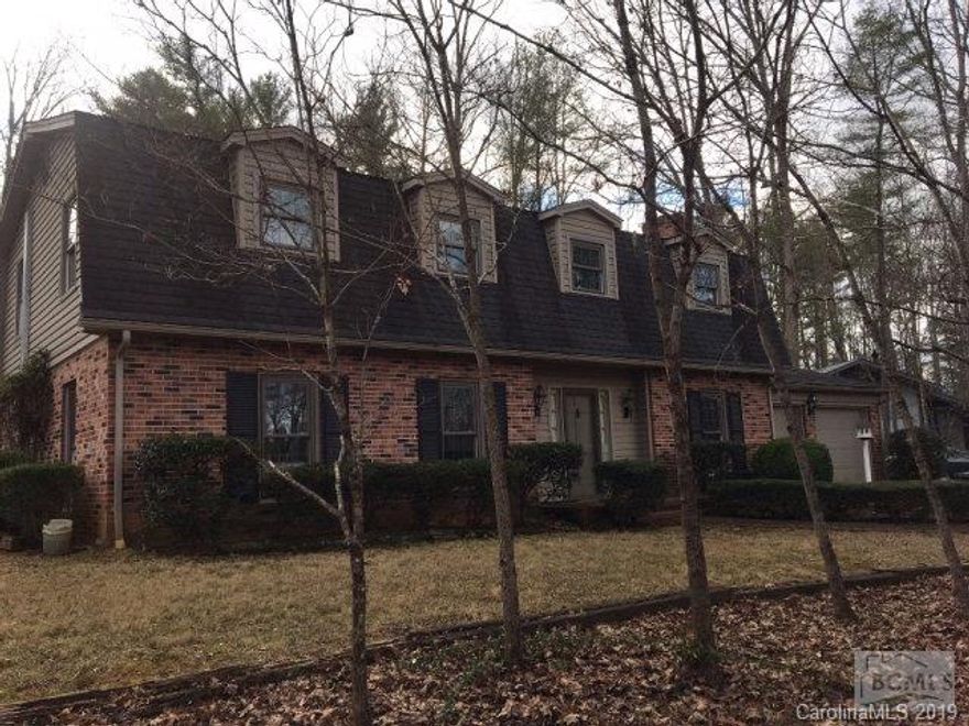 221 Camelot Drive.This spacious home is waiting for a new owner.Perfect for a large family.4 Bedroom,3 and 1 half baths,living room,dining room,den with gas fireplace and built-ins,with large beautiful kitchen with tons of oak cabinets,pantry,and a breakfast area opening to a very large room with a full bath,(could be used as a large master suite,in-law suite or a large game room),decks and patio.Home has beautiful moldings and a gorgeous curved staircase leading to the master bedroom suite with large walk-in closet,sewing room or small office,and a full bath,additional 3 bedrooms and a full bath.2 car garage.Level wooded yard. MLS      234,900