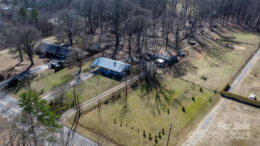 Beautifully renovated 2 bed bungalow nestled on a sprawling 3.69 acre lot, offering endless outdoor possibilities! With dedicated pastures & a spacious utility building/barn, this property is ready to be tailored to you. Inside, hardwood flooring flows throughout the open-concept living spaces. The bright & airy living room seamlessly connects to the charming farmhouse-style kitchen, featuring butcher block countertops, and a SS fridge. On one side of the home, you'll find 2 comfortable bedrooms, including a generous primary suite, along with a full bathroom. The opposite side houses a utility room with extra storage, a laundry area complete with a new sink & convenient access outside. Recent upgrades include: new gutters & new exterior windows '22; septic/pumped/ inspected/replaced lids '23; well repairs pump/lines/lids '23; upgraded electrical to 200 amp '23; a crawlspace vapor barrier/ insulation/ french drain/ sump pump '24; Exterior doors '24; freshly painted interior '25;