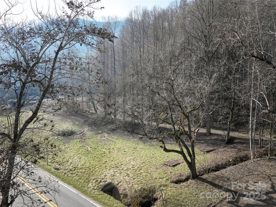 If you're looking to start a business in the Nantahala Gorge, seize this rare opportunity to establish yourself on the last flat acre available near the Nantahala River. This prime location is just minutes from the Nantahala Outdoor Center (NOC), Bryson City, Fontana Lake, and the Appalachian Trail, placing you at the heart of a vibrant outdoor community. The Nantahala Gorge is a major hub for outdoor recreation, attracting over 200,000 paddlers annually, with the majority visiting during the peak summer months. Additionally, U.S. Highway 74 serves as the primary route through the gorge, with average daily traffic counts ranging from 3,600 to 7,000 vehicles, approximately 15% of which are heavy vehicles. This steady flow of visitors and through traffic offers significant exposure and potential for any business catering to outdoor enthusiasts and travelers.
