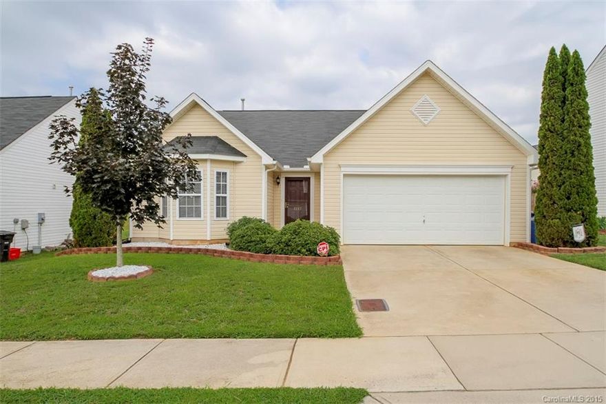 Exceptionally clean and roomy home.  Beautiful laminate wood flooring greets you as you enter the home and walk down the foyer/ hall to the dining room and large family room with fireplace and cathedral ceiling.  New stainless steel appliances highlight the open kitchen.  The breakfast room leads out to patio with a private feel in the back.  The large master bedroom has a trey ceiling, and a huge walk in closet to die for.  The master bath offers separate garden tub, shower & dual vanities.