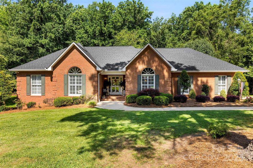 PRICE REDUCTION! Sellers have GOOD news AGAIN to buyers, come book your appointment to see this one! Beautifully maintained 1999 custom-built FULL brick and solid home, offering luxurious quality and thoughtful design throughout. 3 spacious bedrooms and 3 full bathrooms blends comfort, functionality, and versatility in every space. Step inside to discover a light-filled neutral paint main level featuring hardwood floors, vaulted ceilings in the living room, dining room, and one bedroom and a gas fireplace...a cozy centerpiece of the main living area. The primary suite is a true retreat, boasting a large walk-in/roll-in shower, bidet toilet, and double-sink vanity. The kitchen and bathrooms throughout the home feature classic white cabinetry, adding clean style. Laundry room is on the main level and offers an added sink and plenty of cabinetry with lots of space. The walkout basement is a standout feature, perfect for multi-generational living, entertaining or hangout space. It includes a flex room, full bath, fully equipped second kitchen, living area, and access to its own garage—all creating a fully functional second living quarters. A workshop, rear extra parking, circle driveway to the back, full house generator and central vac add even more value and convenience most homes do not have! There is nothing missed on the construction of this home...a must see!