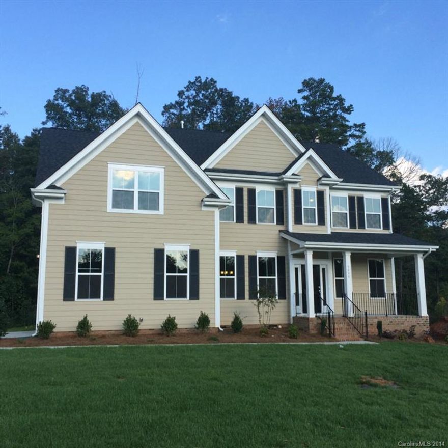 Beautiful new home in a prime location in this community. This home has 4BD/2.5BA, playroom, powder room, and a formal dining room.  This home also has granite, gorgeous hardwoods, 2-car side load garage, private wooded backyard and a spacious deck. This is Weddington Schools. Home is available to close end of Sept. 2014. This home will not last long. It's priced to sell! ***B