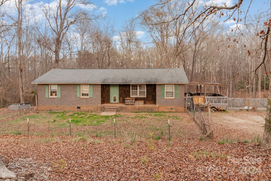 Great Investment Opportunity! Nestled on 5+ Acres! This Charming All Brick Home Features an Open Floor Plan. 3 Bedrooms and 2 Baths on the Main. Additional Living Quarters w/ 4th Bedroom and Bath in the Spacious Basement Area. Outdoor Lover's Dream! Expansive Outdoor Space Perfect for Entertaining or Simply Enjoying the Peaceful Surroundings. Make This One Yours Today!