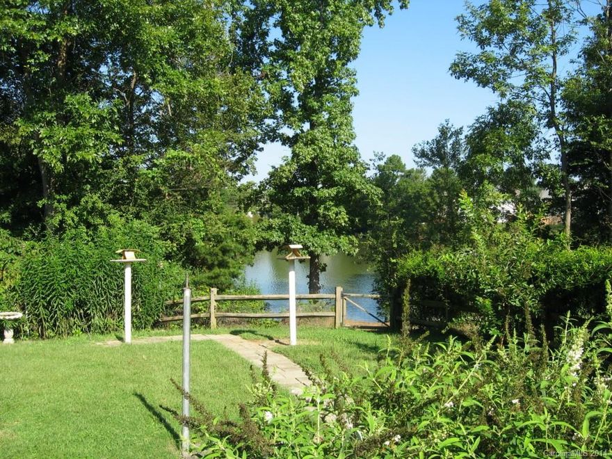 Gorgeous home on hidden private lake minutes to city life. Conveniently located to I-77 and Archdale light rail station. Home has been 1 owner owned and is meticulously kept. Roof in 2012. Wide plank laminate wood floors throughout main floor as well as several rooms upstairs. Granite in kitchen. Outdoor oasis with access to private lake and extensive landscaping in the fenced backyard.