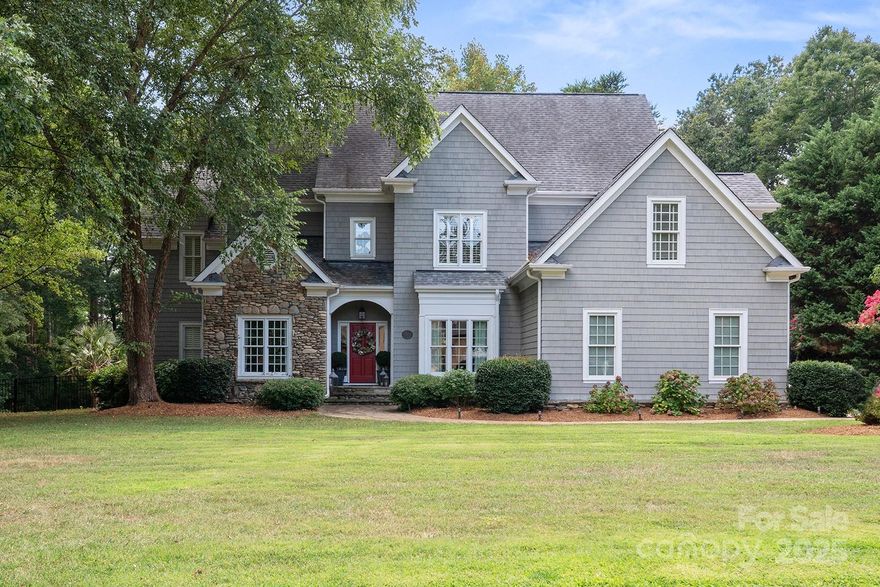 Live the ultimate lifestyle in this stunning home w/deeded boat slip in The Point - Lake Norman's highly desirable luxury community! Ideally located in The Village, within walking distance to Trump National Golf Club, restaurants, pool, fitness, etc (membership req). This 4 bed/4.5 bath retreat on nearly 1 acre offers 4064 sqft, 3-car garage, main-level guest suite, screened back porch, heated saltwater pool, outdoor kitchen, stone patio w/fire pit, and fenced backyard! Recently renovated kitchen, pantry/laundry, primary suite, upper bedrooms w/ensuite baths, main-level baths, and more (2023)! Designer lighting from Arhaus & RH throughout. Grand 20ft foyer, 10ft ceilings on main, hardwoods, and high-end millwork throughout. Office w/french doors & built-ins. Family room w/gas fireplace & coffered ceiling. Butler pantry w/beverage fridge. Large bonus room. Walk-in closets throughout. New HVAC units (2023/2024). Deeded boat slip within walking distance w/new HydroHoist lift (2023)!