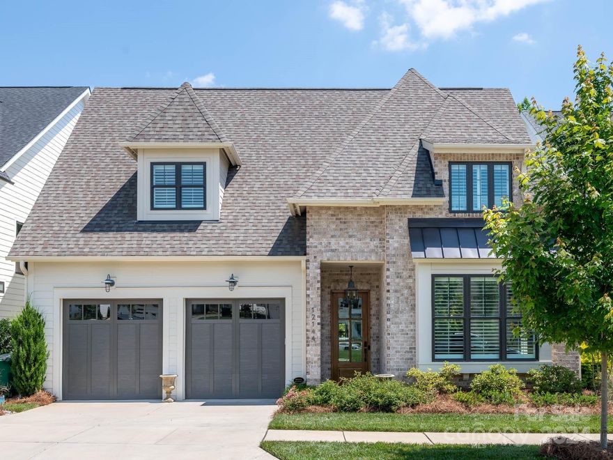 Welcome to your dream home in the exclusive gated community of Cambridge Square! This spacious residence offers over 3,500 sq. ft. of luxurious living space. The main level features two primary suites, each with en-suite bathrooms, and a cozy living room and formal dining area. The kitchen features high end SS appliances, Quartz countertops and an island with seating for four. Upstairs, you’ll find two additional bedrooms, two full bathrooms, two versatile bonus rooms, and another comfortable living room. The backyard is a true oasis, featuring a saltwater pool with a spa and low-maintenance artificial turf. The rear patio includes a fireplace and retractable screened in porch. This home includes a spacious two-car garage and provides the perfect blend of luxury and practicality. Nestled in a secure, serene gated community, it offers peace of mind and a premium lifestyle.  Don't miss out on this exceptional property where no upgrade was overlooked.