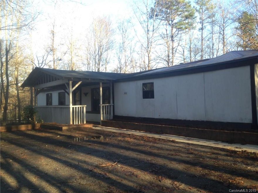 3 bedroom 2 bath modular situated on a beautiful wooded corner lot in Clover School District! Covered front porch, rear deck and a fireplace! Access to both Highway 49 and Highway 55 makes for a quick drive to Lake Wylie and Charlotte!