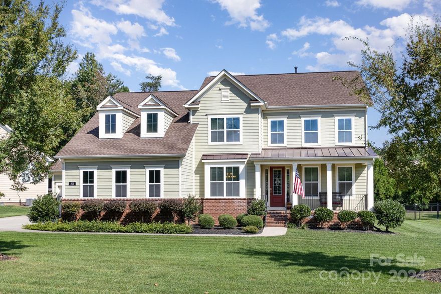 Beautiful home with large lot!  This home offers lovely hardwood flooring, arched doorways, open floorpan with many windows for natural lighting, coffered ceilings, primary bedroom on the main with huge bath and walk-in closet.  Kitchen has large island, granite, ss appliances, gas range, farm sink, lots of storage, formal dining room with serving area; office on main floor with full closet and French doors; 3 large bedrooms up, loft and a bonus room!  Front porch, screened back porch.  Sellers have upgraded with the addition of stone patio with fire pit; sink in laundry, full irrigation, plantation shutters in the den and breakfast area, and a tankless hot water heater.  This is a beautiful home with 3 car garage!