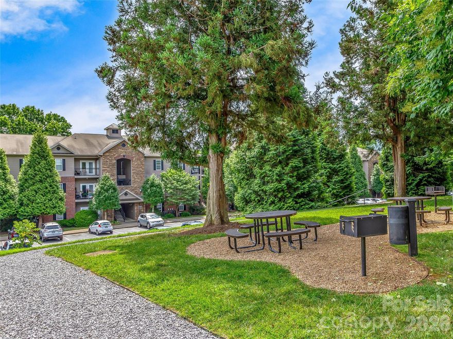 Sweet Condo ready for New Owner! Step into comfort and convenience in this charming condo, located in the heart of south Asheville. Move-in ready and pet friendly! The community is peaceful, with no rentals allowed, so you’ll enjoy a pleasant atmosphere and friendly neighbors. Inside, you’ll find a spacious, modern layout. There are two bedrooms and two baths, offering plenty of space for family, guests, or even a home office. The primary bedroom features an ensuite bathroom with walk-in shower while the second bedroom is perfect for versatility. The living area is bright and welcoming, with an inviting color palette. The kitchen is equipped with stainless appliances. Easy-care flooring in the main areas and cozy carpet in the bedrooms. The east-facing covered balcony is a perfect spot for morning coffee, tending to your favorite plants, or simply unwinding while you take in leafy summer views or mountain vistas in the winter. All appliances, including the washer and dryer, are included. A new HVAC system installed in 2023 (valued at $7,000) ensures comfort year-round. The neighborhood is beautifully landscaped and offers a community picnic area, walking trails for you and your pets, and plenty of onsite parking. This condo is tucked away in a quiet part of the community, giving you the best of both tranquility and accessibility. Located just minutes from downtown Asheville, Biltmore Village, restaurants, and shopping. The peaceful setting and easy access to local attractions make this condo a wonderful place to call home.