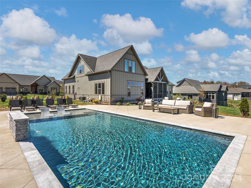 Luxury living at Mills River Crossing! This 4 bedroom, 3.5 bathroom home has a combination of modern elegance and comfortable living. You'll immediately be struck by the beautiful open floor plan and high-end finishes throughout. The kitchen is a chef's dream, boasting stainless steel appliances, custom cabinetry, butler's pantry, and a large center island perfect for meal prep or entertaining guests. The 4 spacious bedrooms all feature walk-in closets and ceiling fans, providing comfort and convenience. The primary bedroom is a true retreat, with an en-suite bathroom with a spa-like shower and soaking tub. Home also has a central vacuum system and fiber optics for optimal connectivity as well as remote control blinds for shade or to enjoy the year round views. Floating ceiling in living and dining areas. The true highlight of this property is the custom heated and lighted Gunite saltwater pool with a commercial-grade heater, UV filters, and auto-fill feature all controlled by WIFI.