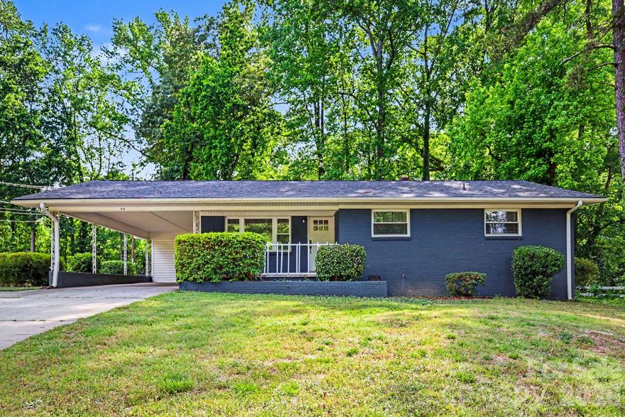 This charming three-bedroom, two-bathroom home in the Sedgefield subdivision offers a perfect blend of modern updates and functional living. The interior features an open-concept floor plan, creating a seamless flow throughout the main living areas that is ideal for both daily life and entertaining. The kitchen serves as a stylish centerpiece, updated with sleek quartz countertops, stainless-steel appliances, modern tile flooring and connects to the dining room. This well-appointed space transitions naturally into the rest of the home, providing a clean and contemporary atmosphere. The primary is spacious and equipped with an updated ensuite with a barn door, unique tile flooring and a large walk-in shower. Enjoy the outdoors on either the covered front porch or backyard deck over looking expansive green space. Located just minutes from downtown Concord, you will enjoy easy access to vibrant shops and dining. The property is also perfectly positioned for commuters, with quick access to I-85 providing a straightforward route to Charlotte and major regional employers. Schedule your private showing today!