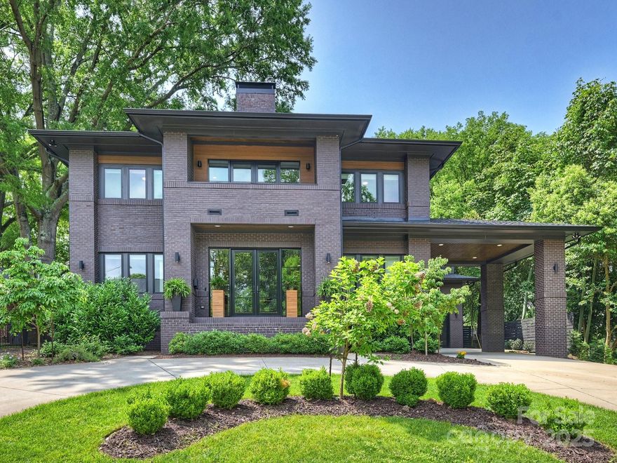 A custom masterpiece in Barclay Downs! Thoughtfully built in Frank Lloyd Wright style with a modern lifestyle in mind by Bonfiglio Builders in 2022. Features an open floor plan and incredible windows throughout.  Expansive living space has a vent free gas fireplace and is open to the chef's kitchen with quartz countertops and custom cabinetry.  Double sliding doors open to the spacious outdoor living room for maximum enjoyment.  The home has it all including two home offices, giant upstairs bonus room, first floor en-suite guest room, scullery off kitchen, huge mud room with custom lockers and drawers, porte cochere, attached garage, circular driveway, large fenced yard.  Remote access to water heater, garage door, heated floors in primary bathroom, security cameras, temperature controls and refrigerator and dishwasher.  Located within walking distance to greenway, top-rated schools, entertainment, dining.  Membership preference at the Barclay Downs Swim & Racquet Club. Welcome home!