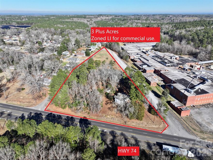 Prime commercial opportunity with over 3 acres of vacant land zoned LI (Light Industrial), offering more than 300 feet of high-visibility frontage along four-lane Highway 74. This tract is ideal for a variety of industrial, commercial, or distribution uses. Excellent access and exposure on a major transportation corridor. Conveniently located approximately one hour from Charlotte and three hours from Wilmington, providing strong regional connectivity. A great investment or development opportunity in a growing area.