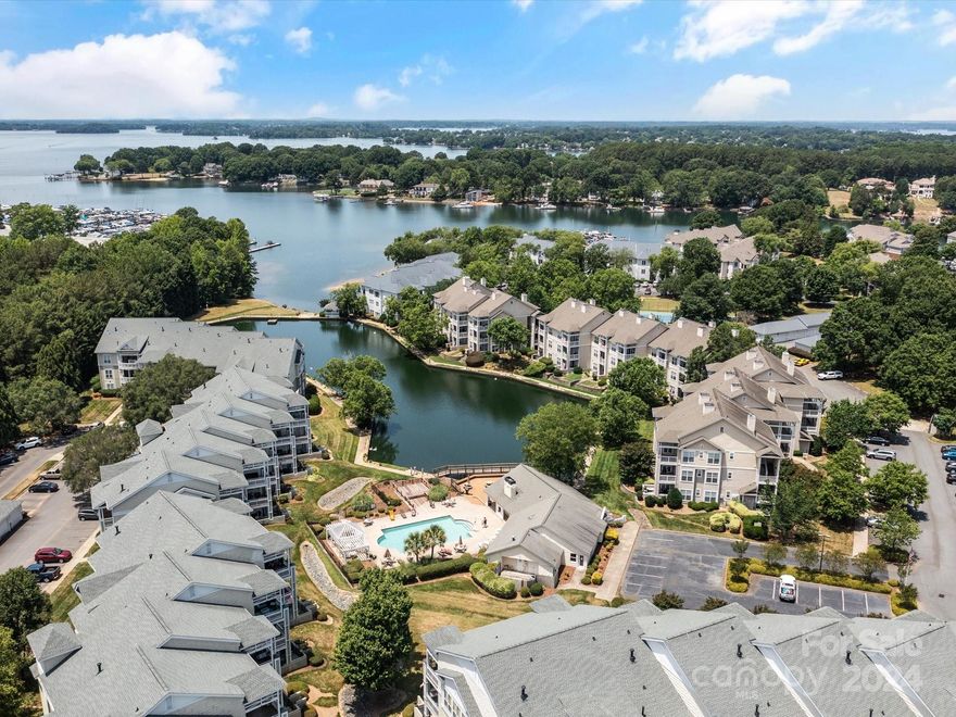 No need to worry about climbing stairs or keeping your car in the hot sun!  Park your car in your GARAGE and hop on the ELEVATOR to your fabulous 3 bedroom/2 bathroom condo overlooking Lake Norman!  Short walk to marina, shopping and restaurants.  Primary Suite includes double sinks and 2 closets.  Enjoy sunsets with your favorite beverage from your balcony overlooking the community pond, fountain, pool and Lake Norman.  NEW items since 2020 include: carpet and LVP flooring, paint, washer/dryer/refrigerator (included with the unit), range, microwave, HVAC systems inside and out, countertops and sinks and faucets in the kitchen and bathrooms, water heater, toilets, disposal and garage springs  Admirals Quarters also has a tennis court, walking trails, clubhouse and exercise room.  Kayak, boat, car, trailer & truck storage available for an add'l fee.  .