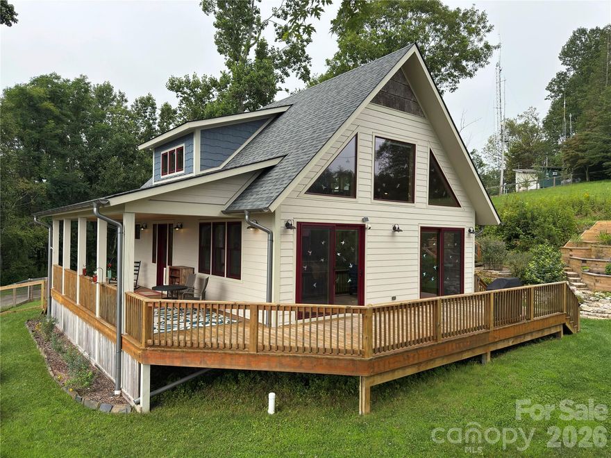 PRICE IMPROVEMENT - RIDGE-TOP HOME WITH SPECTACULAR MOUNTAIN VIEWS!  Carefully Crafted Mountain Retreat with Expansive Views! Discover this thoughtfully designed 2-bedroom, 2-bath home built in 2020, perfectly situated on .74 acres with year-round, long-range mountain views. Step inside to an open floor plan filled with natural light, a modern kitchen with granite countertops, and a versatile loft area. Every detail has been carefully considered for comfort and style. Outside, the property offers a blend of function and beauty: apple trees, temperature-controlled workshop and exercise room, architectural garden with a serene pagoda ample seating area great for entertaining or relaxing, fenced yard perfect for pets and gardening, unique shed with a sliding roof for stargazing in one of the world’s renowned dark sky observatory areas. Located just minutes from the Celo Health Center, local restaurants, breweries, art studios, hiking & biking trails, waterfalls, the South Toe River, and the Blue Ridge Parkway. This home is ideal for anyone seeking mountain living with modern convenience in a beautiful area.  MANY EXTRAS - GREAT OPPORTUNITY!