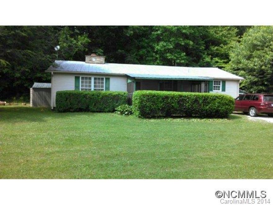 Beautiful country setting...hear the rushing creek (not on property) from the screened in porch, enjoy cool nights by the large wood burning fireplace, plenty of garden space and room to roam. This home has 2 bedrooms and 1 bath, dining room, large eat-in kitchen with lots of cabinet space and a pantry, mud room/laundry room at the back door, attic storage, extra wide hallway and doors. Very convenient to Black Mountain, Asheville, and Marion.