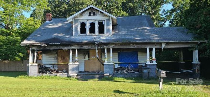 Imagine the possibilities! Here's your chance to own a nearly half-acre piece of prime real estate at 619 N Main Street in Landis, NC. Forget the existing fire-damaged structure – the real gold here is the expansive land, ready for a fresh start. This isn't just a lot; it's a wide-open canvas for your vision, perfect for building that dream home with a sprawling yard or exploring multiple units (subject to zoning, of course) to maximize your return.

Location, location, location! Landis is a dynamic, growing community, strategically positioned just 35 minutes from the vibrant Charlotte metro area and a mere 10 minutes from the burgeoning hub of Kannapolis. Our town is experiencing fantastic growth, with home prices on the rise and exciting developments underway. This is your opportunity to invest in a market that's on the move, offering incredible value and tremendous upside for savvy investors ready to seize the moment!

Sold strictly as-is, where-is.