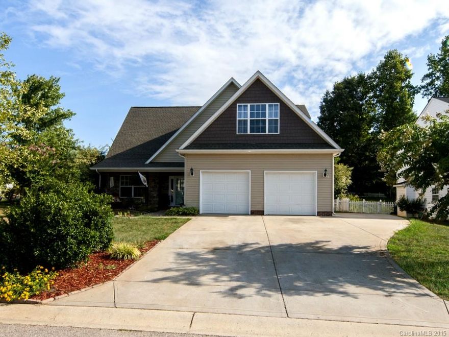 Beautiful home with great master on main floor plan. Spacious 2-Story great room with tons of natural light. 3 bedrooms on upper level with a large bonus room with walk-in closet that can be used as a 5th bedroom. This home is located on a corner lot with screened in patio, a large deck and a fenced in back yard. New wood laminate flooring on the main.