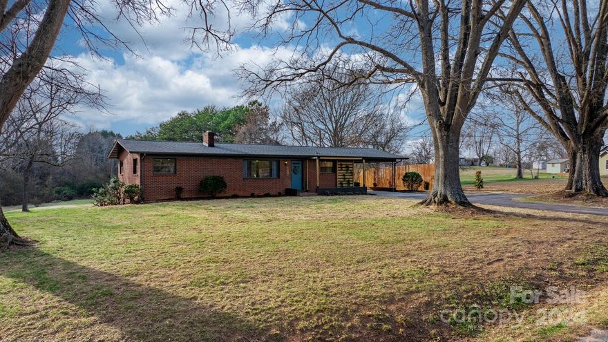 Absolutely adorable mid century brick ranch w/ basement on over an acre in desirable Falling Creek area. This home is close to so many of the amenities Hickory has to offer. 2 spacious BRs & 1 full bath on main level, along w/ a living room, dining area, & flex space that could be used as an office space/den area. Dining is open to the kitchen w/ brand new SS appliances, butcher block countertops, &2 tone cabinets. New flooring throughout most of the home. Downstairs you have a 1 car garage/workshop area w/ brand new garage door. On the partially finished side, new vinyl flooring has been added throughout and there is a second full bathroom. Large unheated bonus space has so much potential for a hangout area, rec room/whatever you need it for & also includes a cozy fireplace w/ electric insert. Laundry closet also located in bonus room. Roof less than 3 yrs old! 2nd bathroom is not heated/cooled & you walk thru unfinished space to get to it.