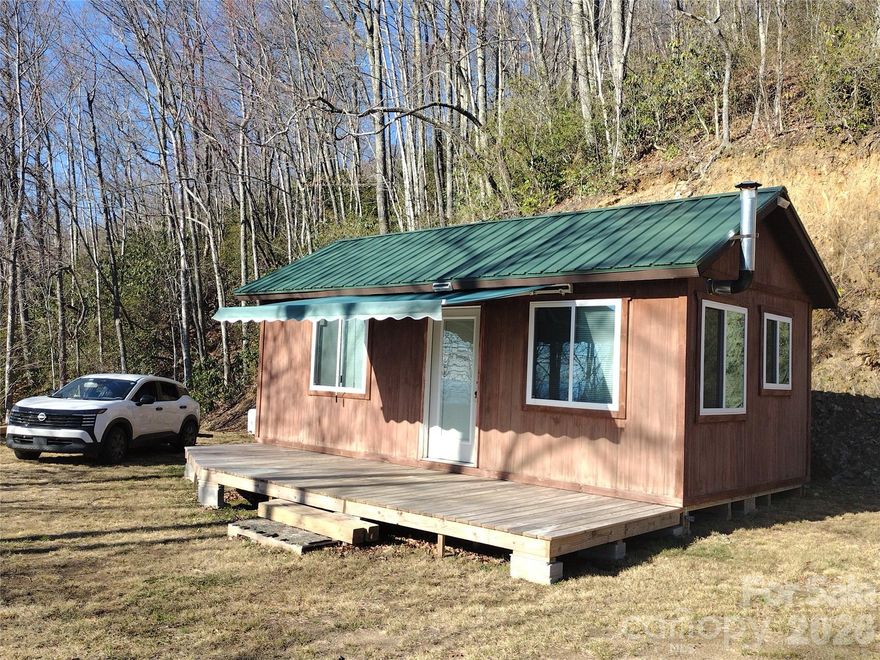 Flexible Owner Financing Available on this peaceful, private, & pristine 4.6 Acres of Gorgeous Mountain Views! An Off-Grid Primitive Rustic Camp Cabin is already in place! Escape to this quiet Black Rock Creek Community where roads are maintained, so you are worry-free with a tapped-spring on property, plenty of wildlife in the area AND it features a hidden gem- a potential 2nd building pad from a separate road access (off Henry Ridge Tr.). The property features long-range views of the Smoky Mountain National Park, & the Blue Ridge Parkway from the current building pad where the rustic cabin allows you to wake up to pristine peaceful mountain scenery. This unique property is minutes from Maggie Valley, Harrah's Casino, Downtown Cherokee, Santa's Land Zoo & Theme Park, Smoky Mountain National Park & The Blue Ridge Parkway. This ultimate natural paradise of serenity awaits you at this true mountain oasis.