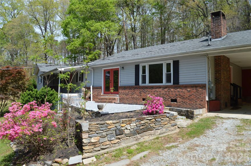 Take a look!  This ranch style home had undergone a serious amount of mostly interior renovation by a previous owner and is now owned by the lender and includes two parcels.  Improvements include both bathrooms, the kitchen, all new appliances, vinyl plank flooring, carpeting, and more. The windows and French doors are updated, and there are apparent electrical and plumbing updates as well.  There is a masonry fireplace in the living room that has an insert. The primary bedroom has a spacious walk in closet with built-ins.  There is a walk in laundry room, covered front porch, stone patio, seasonal mountain view and plenty of room to garden.   Check it out and bring an offer!