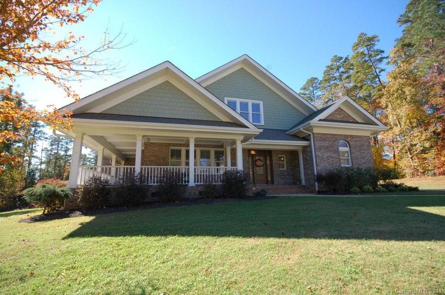 Gorgeous custom built brick home on a corner lot in quiet Forest Bay Subdivision in Belmont, NC, at the northern tip of Lake Wylie in Gaston County. Large .83 lot w/a seasonal water view. Front porch. Outdoor living area w/kitchen, living area, fireplace, fenced yard. Enjoy the open floor plan ideal for entertaining on the main level. Kitchen has double ovens, 2 sinks, granite countertops, tile floor, stainless appliances, spacious pantry w/2nd refrigerator. Beautiful moldings, 10' ceilings,