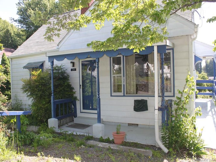 Charming in town 3BR, 1BA cottage. Beautiful hardwood floors, major appliances & large basement. Great mountain view, sunny terraced garden area, parking in front & back. Recently renovated with additional potential. Detached single garage. Ready to move in!
